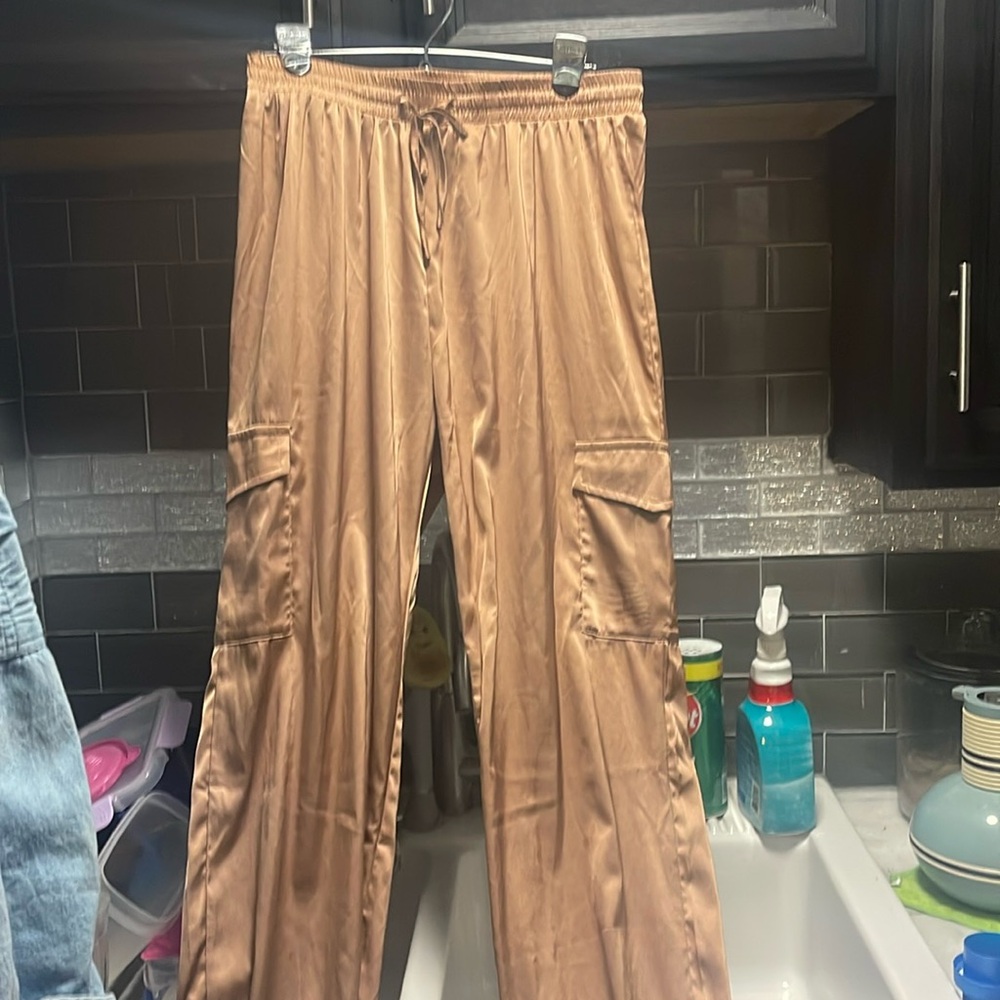 Gold balloon satin pants with tight bottom size large with pockets